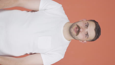 Vertical-video-of-Man-giving-motivational-speech-to-camera.